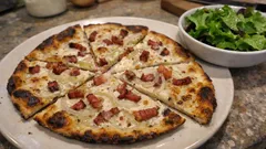 Crisp Flammekueche (Tarte Flambée) — thin flatbread with crème fraîche, onions and lardons